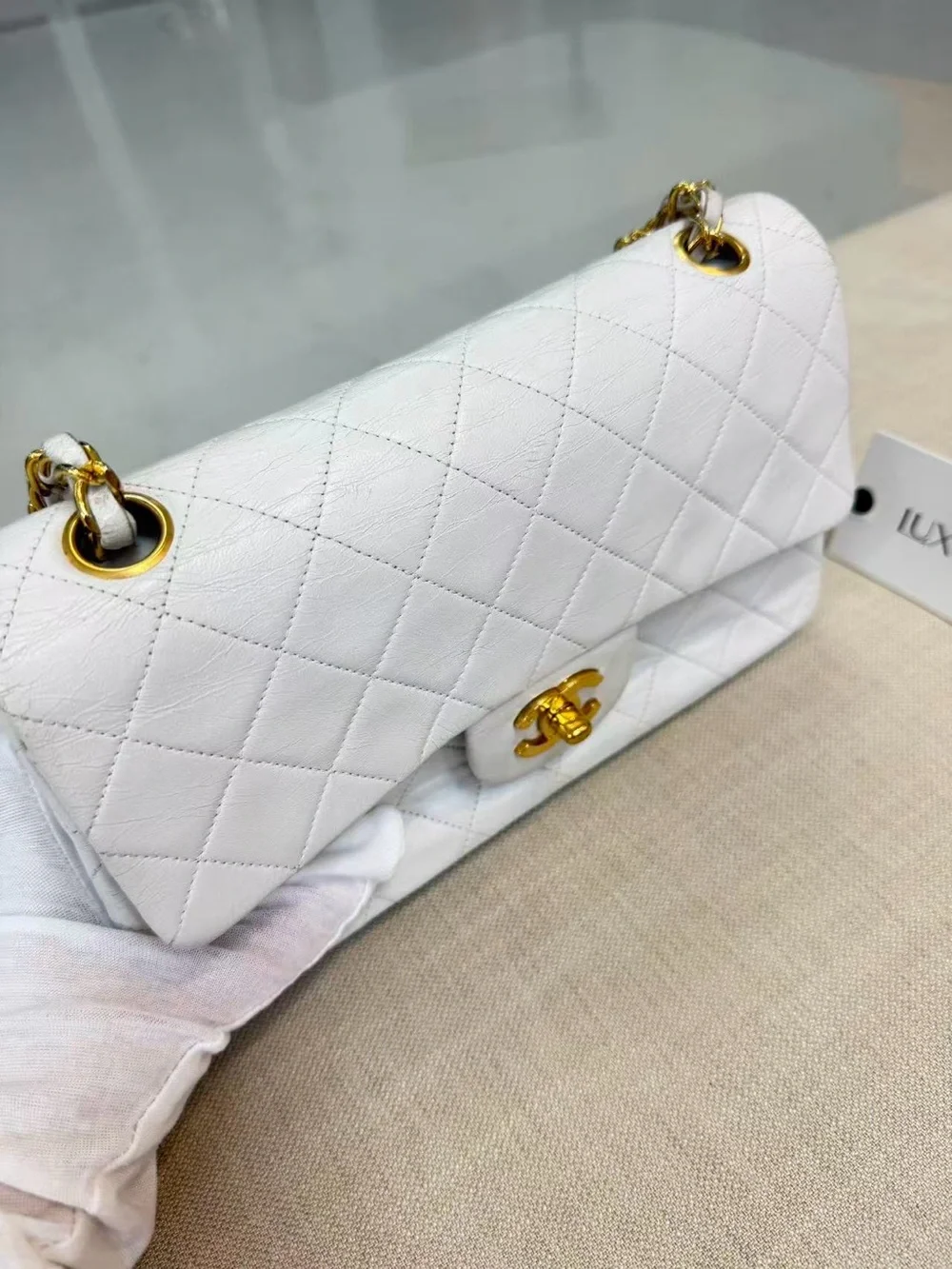 Vintage CHANEL White Quilted Leather Shoulder Bag with Gold Chain and CC Lock